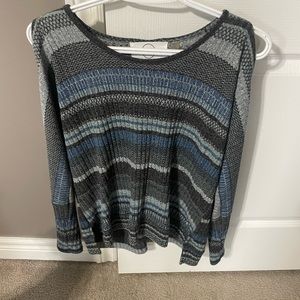 Light top, shoulders exposed. Looks great with jeans or dress pants.